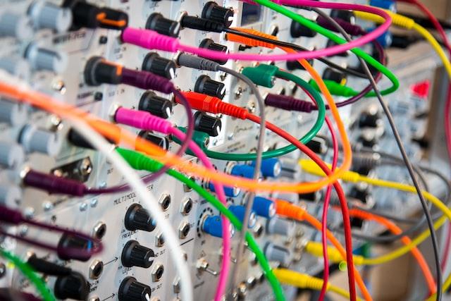 various brightly coloured wires connecting to various ports